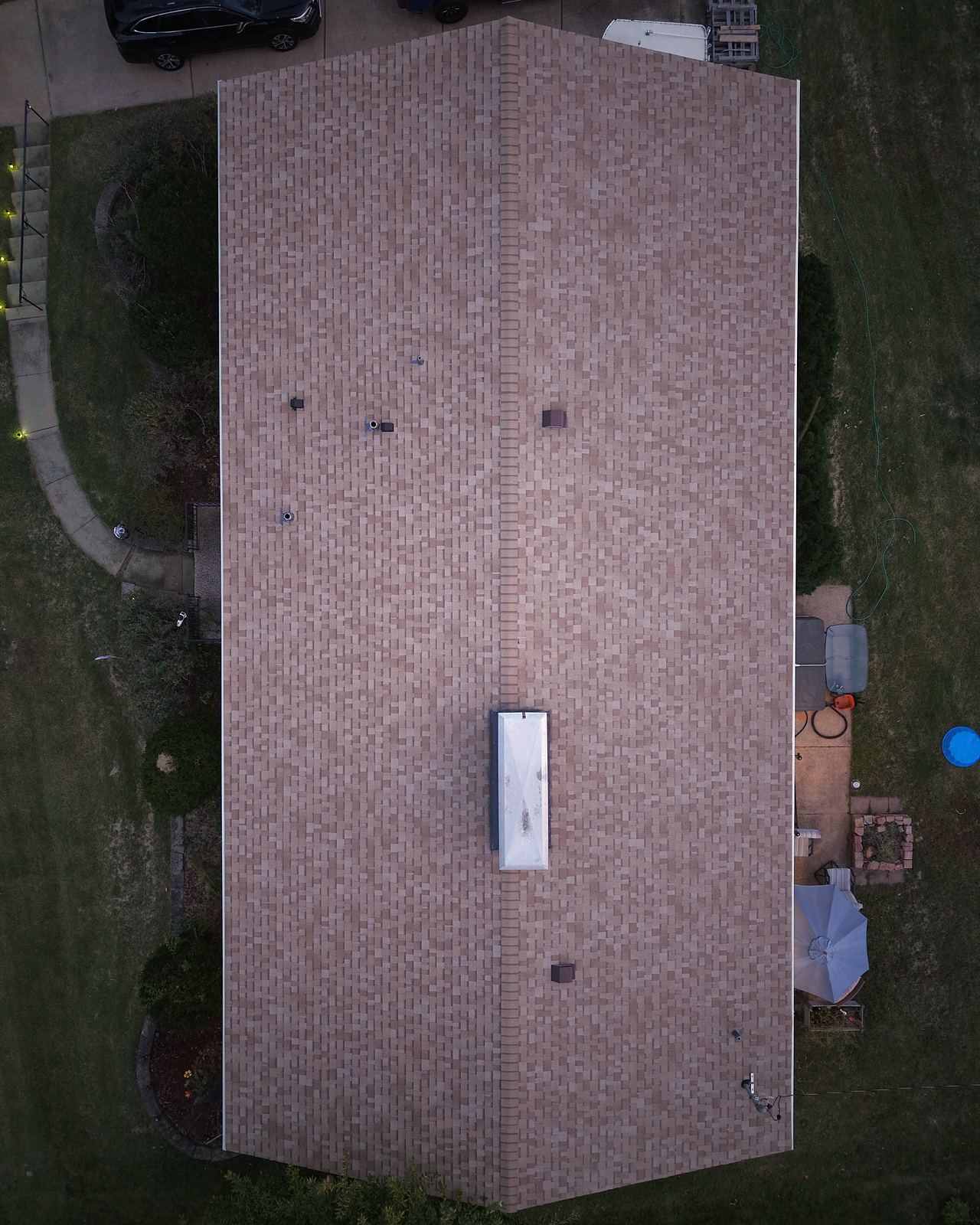 Straight-down aerial view of a residential shingle roof